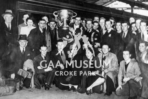 Tadgh O Crowley holding aloft the Sam Maguire Cup in 1945