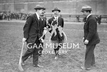 Load image into Gallery viewer, Black and white photograph from the GAA Museum archive, featuring Michael Collins, Luke O&#39;Toole and Harry Boland at Croke Park, 1921.
